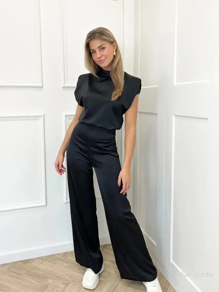 Elegant Rygglös Jumpsuit med Vida Ben | Lätt och Bekväm för Sommar Elegant Rygglös Jumpsuit med Vida Ben | Lätt och Bekväm för Sommar